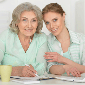 Woman and Caretaker with Laptop